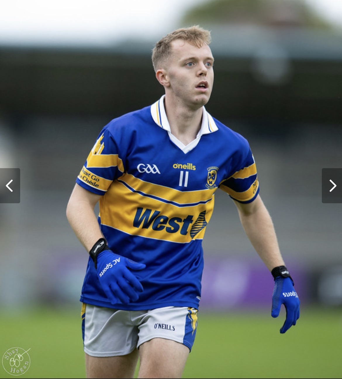 Championship player wearing blue AC Sports gloves